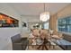 Elegant dining room features a large mirror and a chandelier reflecting light at 5203 Bayshore Blvd # 6, Tampa, FL 33611