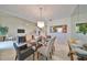 Elegant dining room featuring a glass-top table and chandelier at 5203 Bayshore Blvd # 6, Tampa, FL 33611