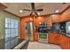 Modern kitchen with stainless steel appliances and wood cabinets at 5203 Bayshore Blvd # 6, Tampa, FL 33611