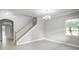 Bright dining room with tiled floors, staircase, and view to another room at 3831 Evergreen Oaks Dr, Lutz, FL 33558