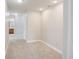 Bright hallway with carpet flooring and access to bedrooms and bath at 3831 Evergreen Oaks Dr, Lutz, FL 33558