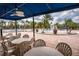 Covered patio tables overlooking the community pool at 3831 Evergreen Oaks Dr, Lutz, FL 33558