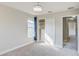 Bright bedroom with carpet, window, and built-in shelving at 3831 Evergreen Oaks Dr, Lutz, FL 33558