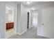 Bright hallway with carpet flooring and access to bedrooms and bath at 3831 Evergreen Oaks Dr, Lutz, FL 33558