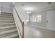Elegant staircase leading to upper level with chandelier at 3831 Evergreen Oaks Dr, Lutz, FL 33558