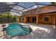 Inviting screened pool with large patio at 3831 Evergreen Oaks Dr, Lutz, FL 33558