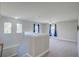 Spacious loft area with carpet flooring, ceiling fan and windows at 3831 Evergreen Oaks Dr, Lutz, FL 33558