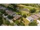 Aerial view of house and neighborhood, showcasing a peaceful community near a golf course at 3831 Evergreen Oaks Dr, Lutz, FL 33558