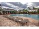 Resort-style pool with lounge chairs and clubhouse in background at 3831 Evergreen Oaks Dr, Lutz, FL 33558