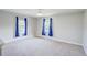 Spacious bedroom with carpet and two large windows at 3831 Evergreen Oaks Dr, Lutz, FL 33558