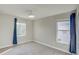 Spacious bedroom with neutral wall color and two windows at 3831 Evergreen Oaks Dr, Lutz, FL 33558