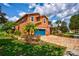 Two story house with a blue garage door and manicured lawn at 3831 Evergreen Oaks Dr, Lutz, FL 33558