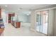 Open concept kitchen with island and access to backyard patio at 3831 Evergreen Oaks Dr, Lutz, FL 33558