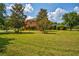 Beautiful two story house with lush green lawn at 3831 Evergreen Oaks Dr, Lutz, FL 33558
