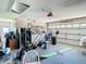 Garage with golf equipment, tools and storage at 28330 Openfield Loop, Wesley Chapel, FL 33543