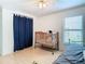 Bedroom with crib and daybed near window at 28330 Openfield Loop, Wesley Chapel, FL 33543