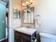 Clean bathroom with a single sink vanity and toilet at 28330 Openfield Loop, Wesley Chapel, FL 33543