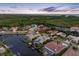 Scenic aerial view of luxury homes nestled along the waterfront with lush green surroundings and picturesque sky at 5510 E Longboat Blvd, Tampa, FL 33615