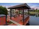 Beautiful wooden covered pier with views of the waterway and surrounding homes at 5510 E Longboat Blvd, Tampa, FL 33615