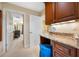 Bathroom vanity area featuring granite countertops, wood cabinets, and ample lighting at 5510 E Longboat Blvd, Tampa, FL 33615
