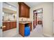 Hallway featuring a vanity space and access to the bathroom and closet at 5510 E Longboat Blvd, Tampa, FL 33615