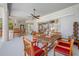 Covered patio with a ceiling fan, wet bar, and comfortable seating area, perfect for entertaining at 5510 E Longboat Blvd, Tampa, FL 33615