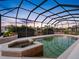 Private screened-in in-ground pool and hot tub combo with scenic waterway views at 5510 E Longboat Blvd, Tampa, FL 33615