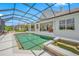 Inviting swimming pool and spa with screened enclosure at 5510 E Longboat Blvd, Tampa, FL 33615