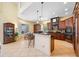 Spacious kitchen with granite countertops, wood cabinets, and stainless steel appliances at 5510 E Longboat Blvd, Tampa, FL 33615