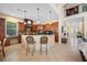 Open kitchen with an island, wood cabinets, and high-end stainless steel appliances at 5510 E Longboat Blvd, Tampa, FL 33615