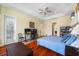 Bright main bedroom with hardwood floors, large windows, and a home office space at 5510 E Longboat Blvd, Tampa, FL 33615