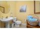 Small, well-appointed bathroom with pedestal sink at 5510 E Longboat Blvd, Tampa, FL 33615