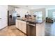 Kitchen with island and stainless steel appliances at 13292 Golden Lime Ave, Spring Hill, FL 34609