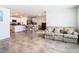 Open concept kitchen and living area with island at 13292 Golden Lime Ave, Spring Hill, FL 34609