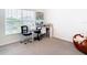 Study with a desk, two chairs, and a large window at 13292 Golden Lime Ave, Spring Hill, FL 34609