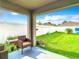 Covered patio overlooks a fenced backyard with grassy lawn at 13292 Golden Lime Ave, Spring Hill, FL 34609