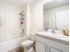 Clean bathroom with a bathtub, toilet, and vanity at 13292 Golden Lime Ave, Spring Hill, FL 34609