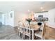 Bright dining area with glass table and chairs at 13292 Golden Lime Ave, Spring Hill, FL 34609