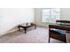 Sitting room with window, couch, and coffee table at 13292 Golden Lime Ave, Spring Hill, FL 34609