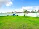 Spacious backyard with grassy area and privacy fence at 13292 Golden Lime Ave, Spring Hill, FL 34609