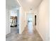 Bright hallway with tile floors, leading to bedrooms at 13292 Golden Lime Ave, Spring Hill, FL 34609