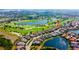 Aerial view of a luxury home community with golf course and lake at 15908 Castle Park Ter, Lakewood Ranch, FL 34202