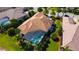 Luxury home with pool and screened enclosure, aerial view at 15908 Castle Park Ter, Lakewood Ranch, FL 34202