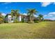 Landscaped backyard with lush lawn and partial view of home at 15908 Castle Park Ter, Lakewood Ranch, FL 34202