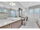 Elegant bathroom with double vanity and walk in shower at 15908 Castle Park Ter, Lakewood Ranch, FL 34202