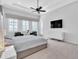 Spacious Primary bedroom with large windows and plush carpet at 15908 Castle Park Ter, Lakewood Ranch, FL 34202