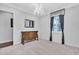 Spacious bedroom with a beautiful chandelier and built-in storage at 15908 Castle Park Ter, Lakewood Ranch, FL 34202