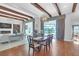 Bright dining room with hardwood floors and a view to the backyard at 15908 Castle Park Ter, Lakewood Ranch, FL 34202