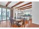 Spacious dining room with hardwood floors and kitchen view at 15908 Castle Park Ter, Lakewood Ranch, FL 34202