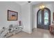 Elegant entryway with ornate doors and unique console table at 15908 Castle Park Ter, Lakewood Ranch, FL 34202